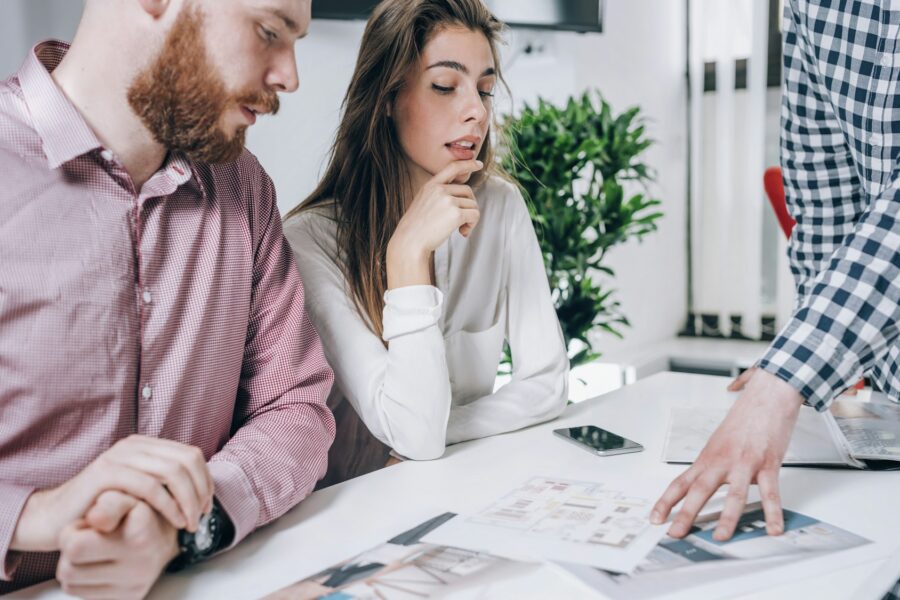 Couple in Real-Estate Agency Talking to Real Estate Agent